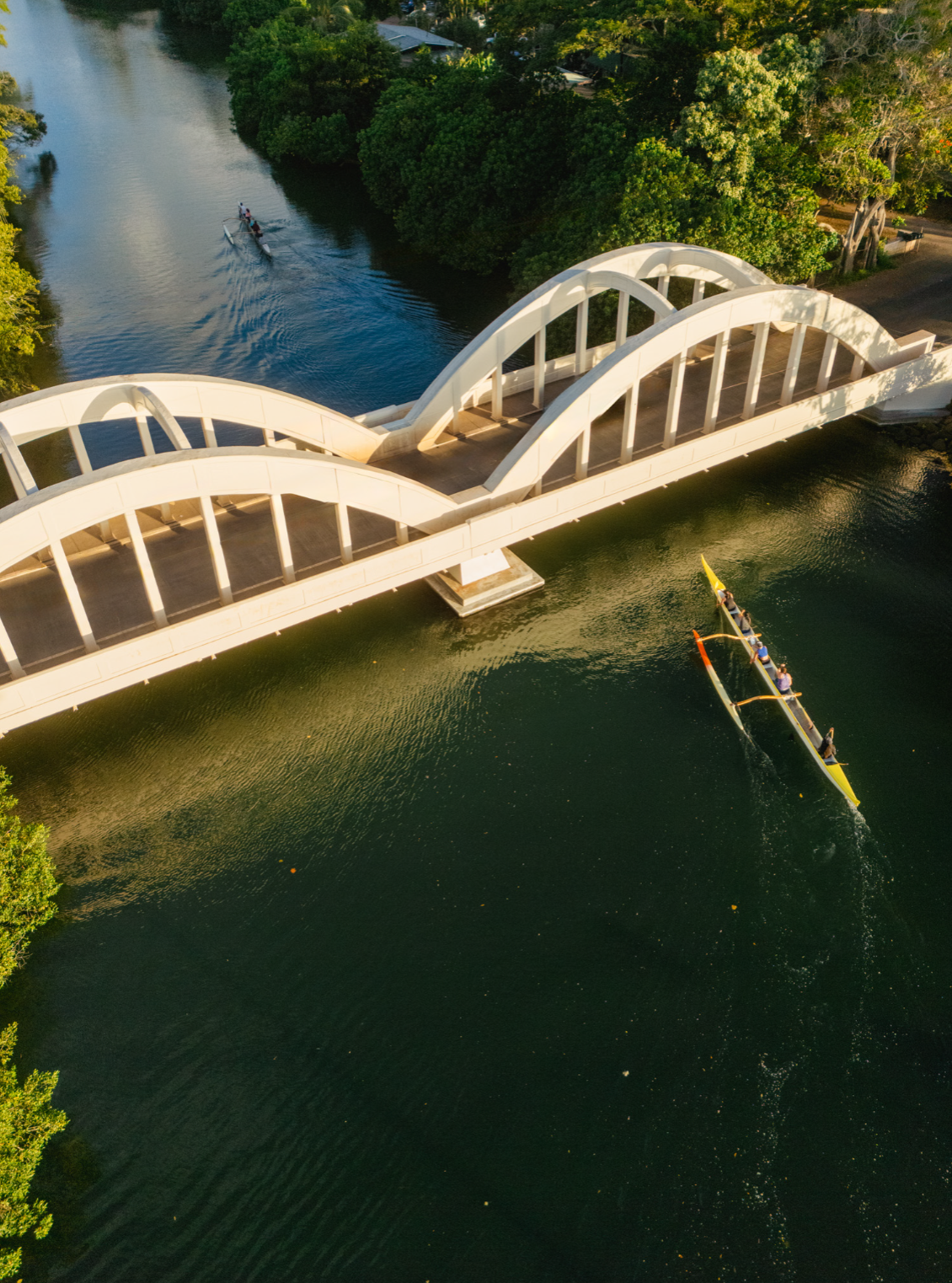 aerial shot of haleiwa bridge with canoe